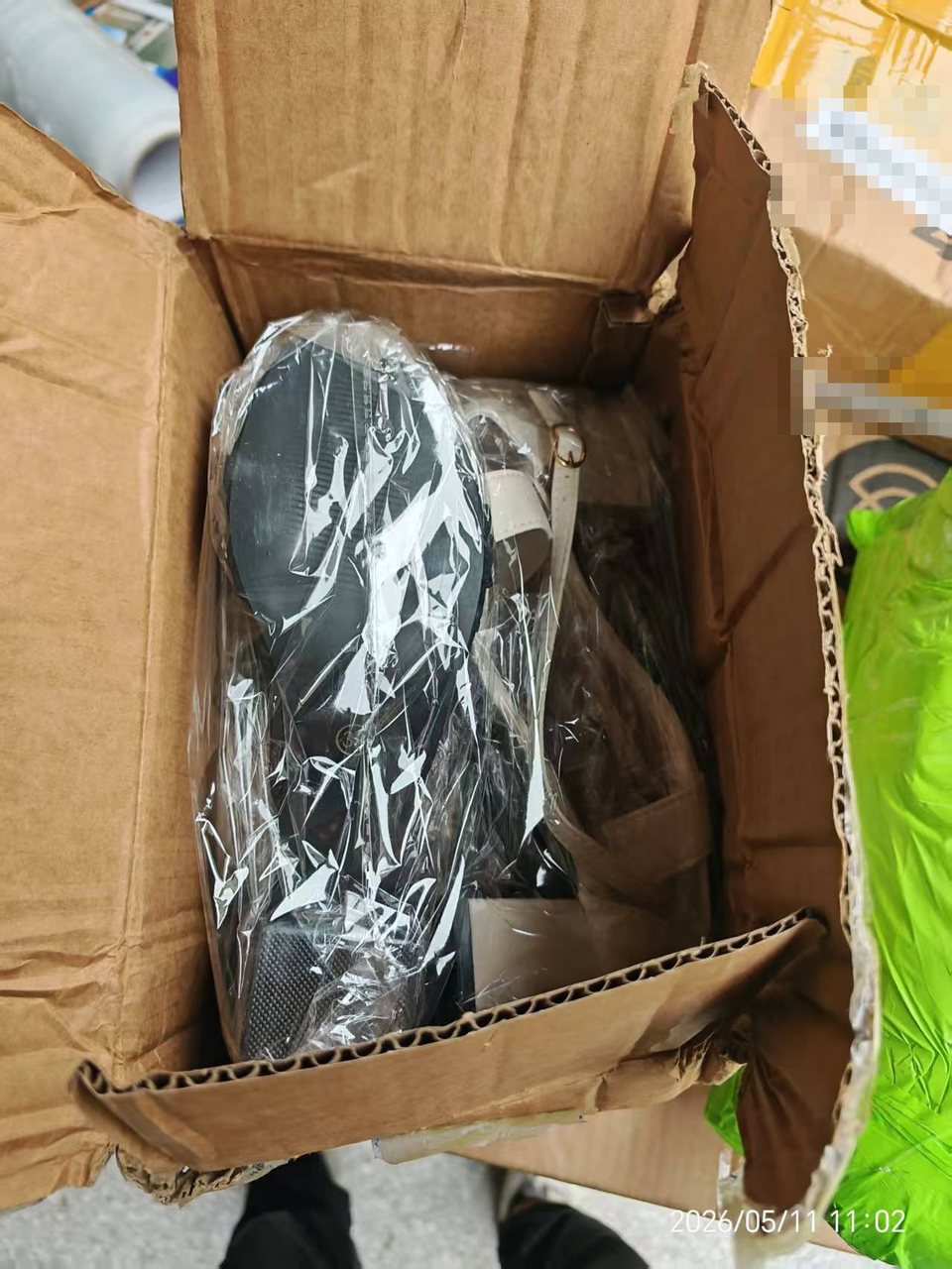 Open-carton check showing items unpacked for a warehouse record