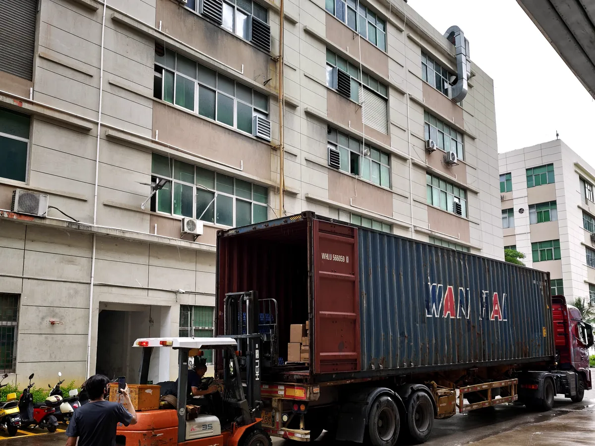 Container and forklift during a loading operation in Shenzhen
